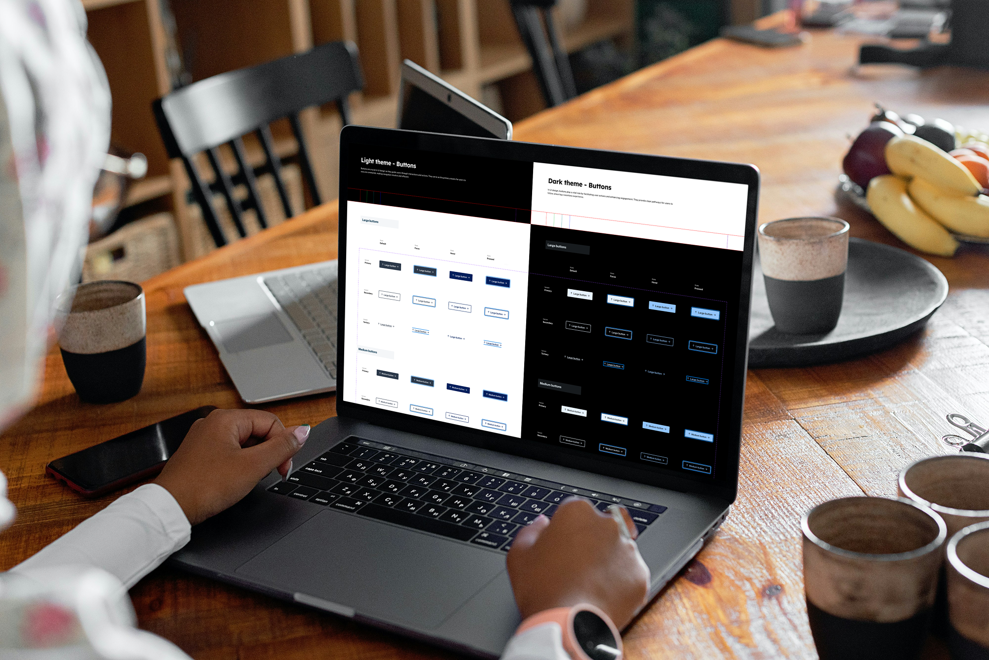 Individual interacting with the design system on a laptop